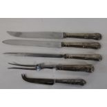 Four pieces of Continental silver handled items & hallmarked silver cheese knife