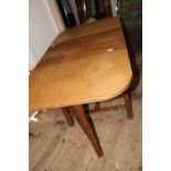 A vintage 'Lizard Man' oak drop leaf table with draw.