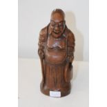 A 18th Century Chinese wooden elder with bag over shoulder 30cm tall