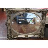 A large baroque style silver gilt framed wall mirror 104cm x 84cm Collection Only