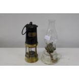 A vintage colliery coalminers lamp and glass oil lamp