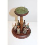 A treen seamstresses bobbin holder with pin cushion 19cm tall