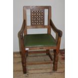 A Robert 'Mouseman' Thompson oak adzed carver chair with lattice work back panel and trademark