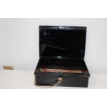 A black metal deed box with key 38cm x 27 cm