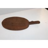 A Robert 'Mouseman' Thompson of Kilburn cheese board with carved mouse to handle. Overall length