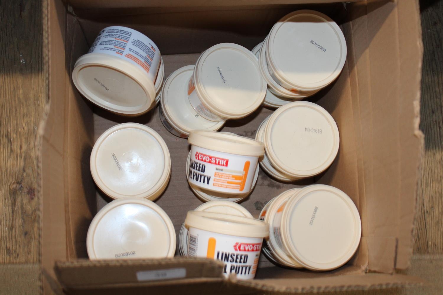 A box of new linseed oil putty