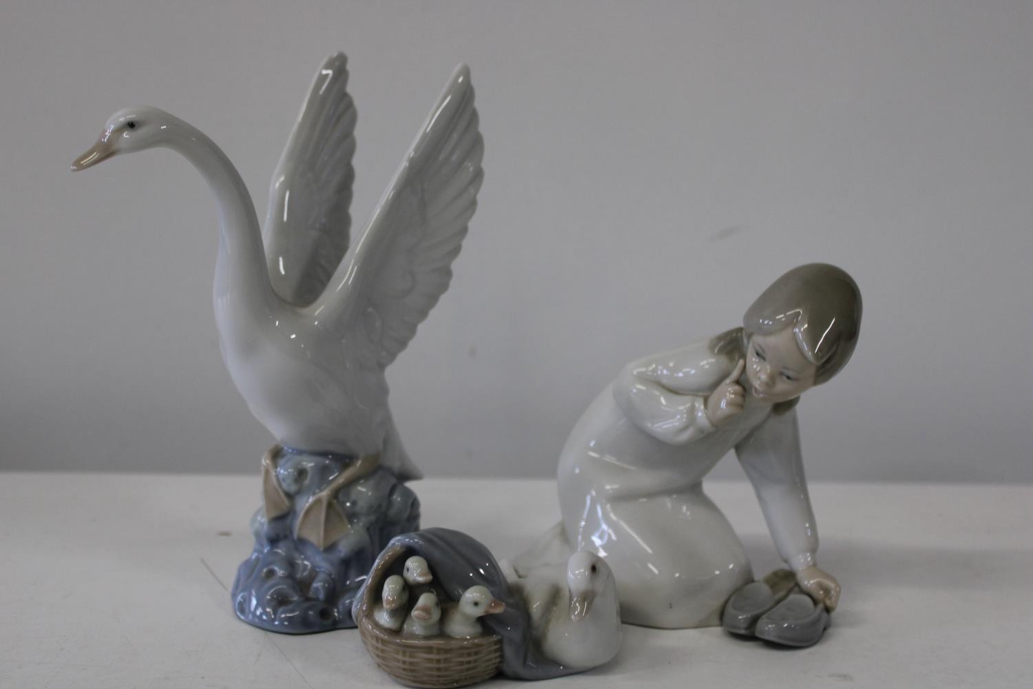 Two Lladro and a Nao figure largest 20cm tall