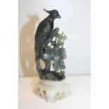 A carved soapstone figure 16cm tall