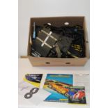 A box of Scalextric track & accessories