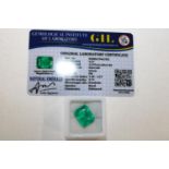 A emerald gemstone with cert