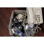 A box full of telephones & accessories