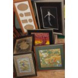 A box of assorted framed artwork