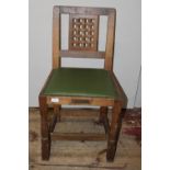 A Robert 'Mouseman' Thompson oak adzed chair with lattice work back panel and trademark carved mouse