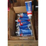 A box of new tubes of white grout reviver. Collection only