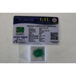 A emerald gemstone with cert