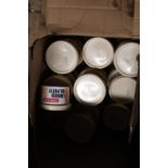 A box full of new tubs of linseed oil putty