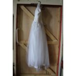 A wedding dress size 10-12 Espada