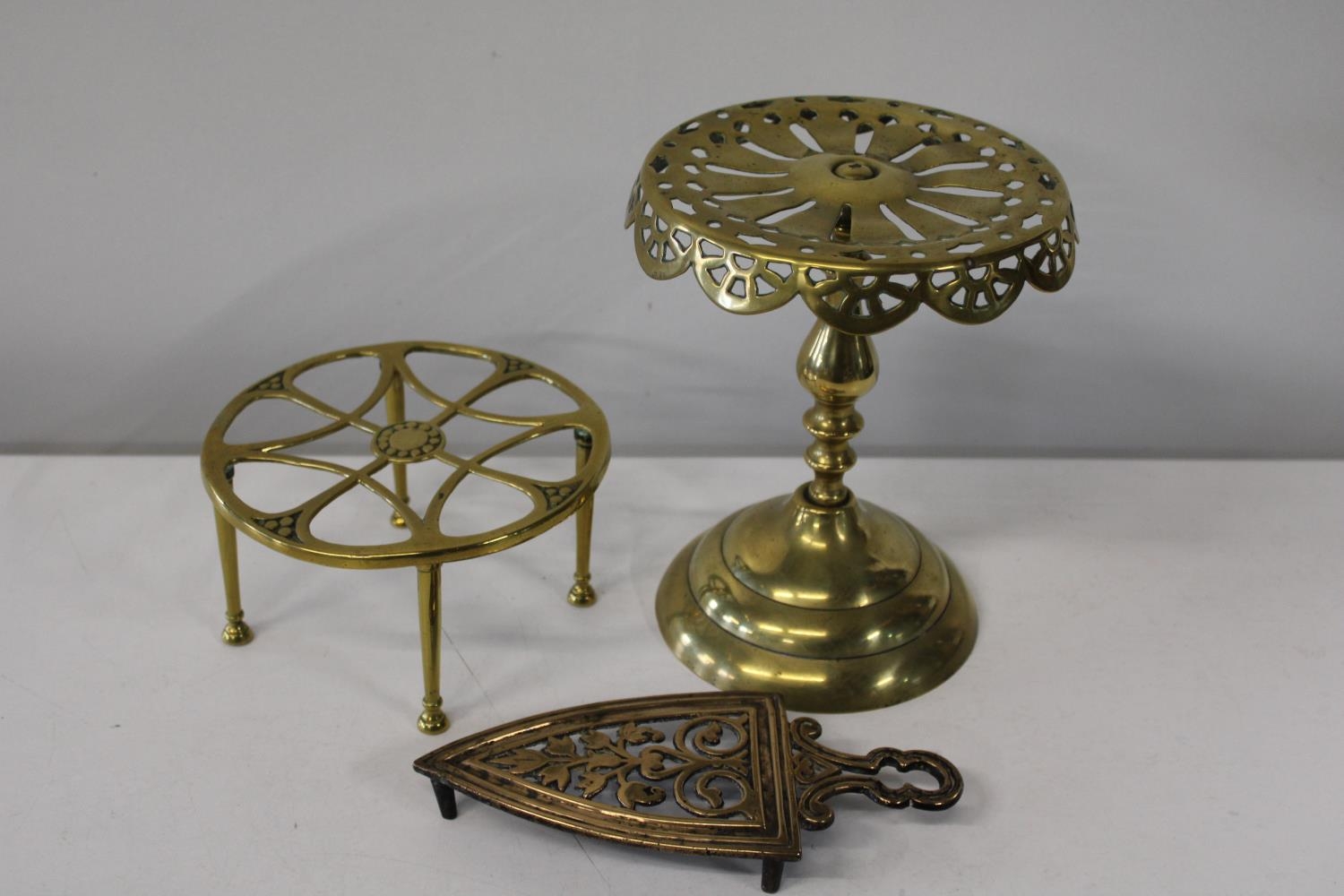 A selection of brass trivets etc