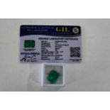 A emerald gemstone with cert