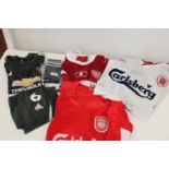 A selection of assorted football shirts etc