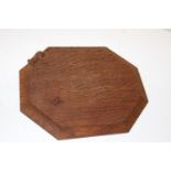 A Robert 'Mouseman' Thompson of Kilburn hexagonal bread/chopping board with carved mouse to one