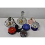 A selection of paperweights and vintage bottles etc