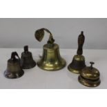 A collection of assorted brass bells