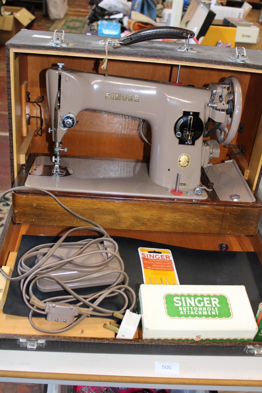 A vintage electric Singer Sewing machine with accessories Collection Only