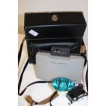 A Polaroid 104 camera and good quality case