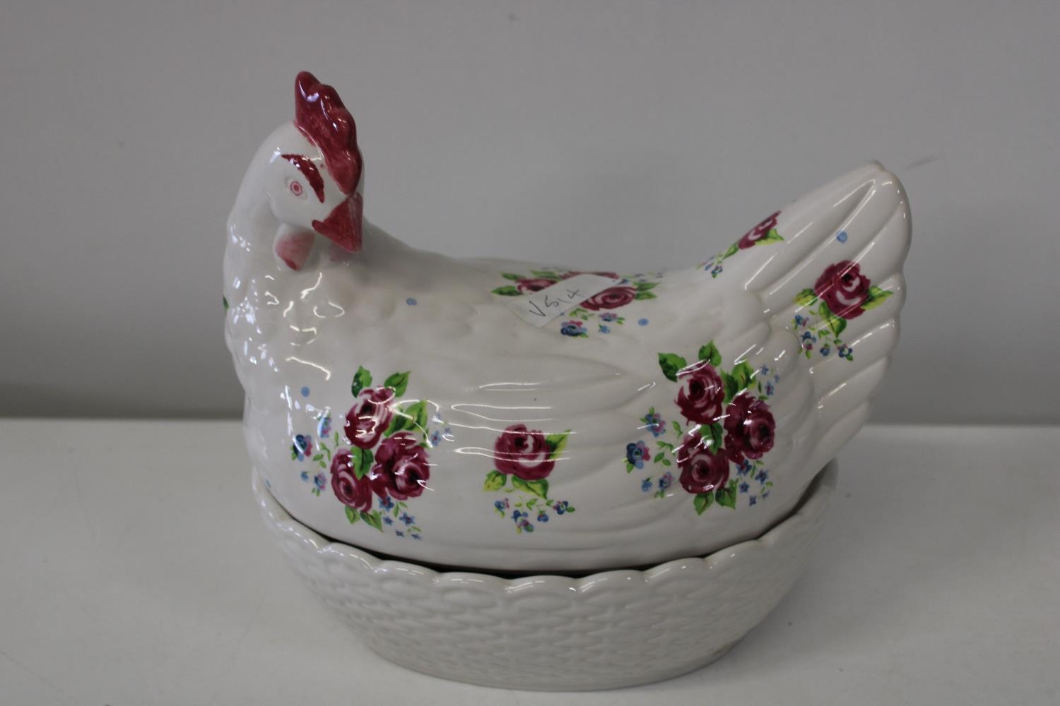 A bone china chicken form egg basket