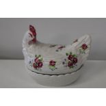 A bone china chicken form egg basket