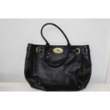 A ladies stamped Mulberry leather handbag