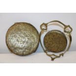 Two brass gongs, one on a stand