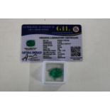 A emerald gemstone with cert