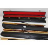 A selection of cased snooker/pool cues