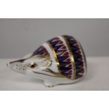 A Royal Crown Derby paper weight in the form of a hedgehog with white stopper.