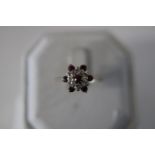 A 9ct gold ruby cluster ring size Q