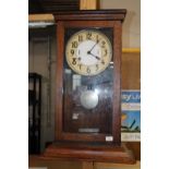 A oak cased International Time Recorder wall clock in working order 80cm tall collection only