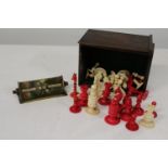 A vintage ivory chess set (damaged) and a brass perpetual desk calendar