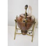 A vintage copper kettle & burner on a brass stand