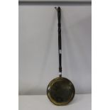 A brass and wooden handled bed pan L100cm Collection Only
