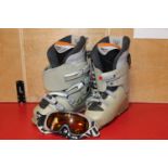 A pair of ski boots size 6 1/2 & snow goggles