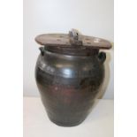 A antique ceramic urn with wooden cover h42cm