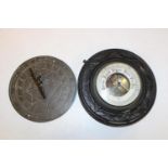 A vintage barometer & brass sun dial