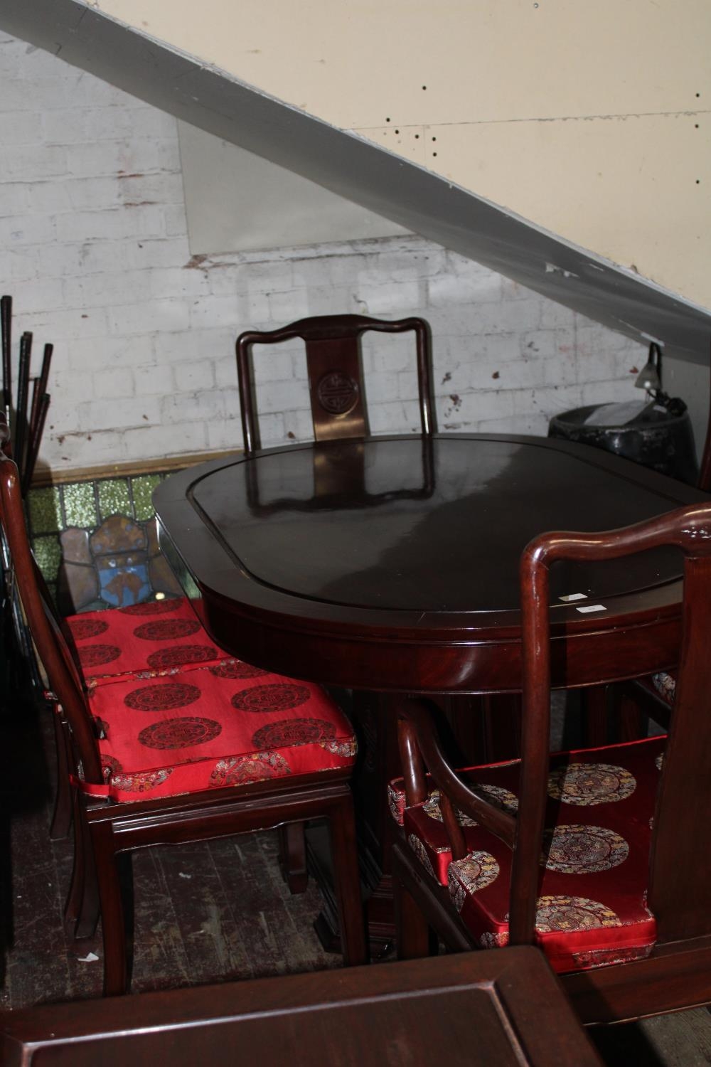 A Chinese rosewood dining table and six chairs. 153x76x96cm Collection Only