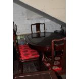 A Chinese rosewood dining table and six chairs. 153x76x96cm Collection Only