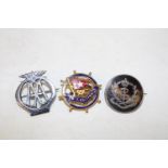 Three assorted collectable badges including silver
