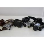 A collection of vintage cameras & lenses