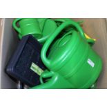 A box of new watering cans & seed trays Collection Only