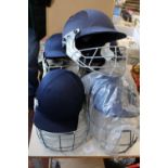 An assortment of cricket helmets